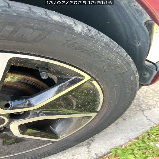 Tyre sidewall with a cut, photographed during a vehicle inspection